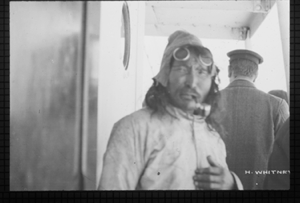 Image of Man aboard in goggles, smoking